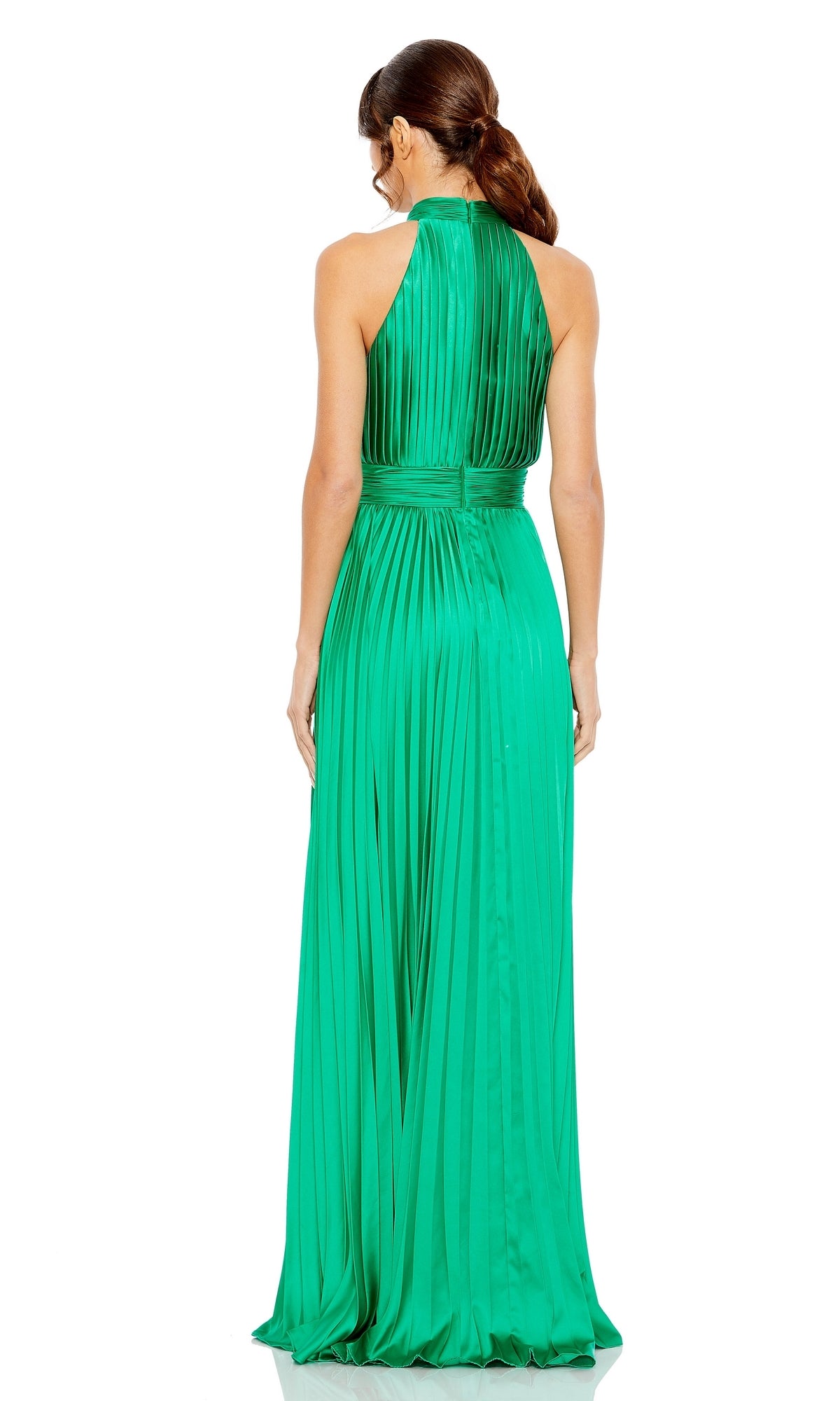 A woman with brown hair in a ponytail models the Long Pleated A-Line Formal Dress: Mac Duggal 26992 in green, shown floor-length and sleeveless from the back against a white background.